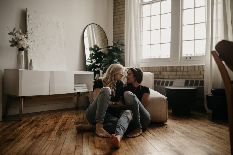 Engagement photographer takes picture of couple in their apartment in Toronto Canada.